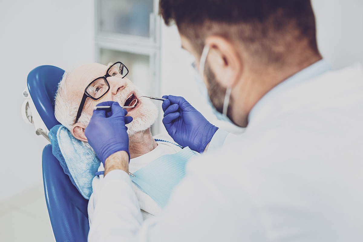 Competent medical worker examining his visitor